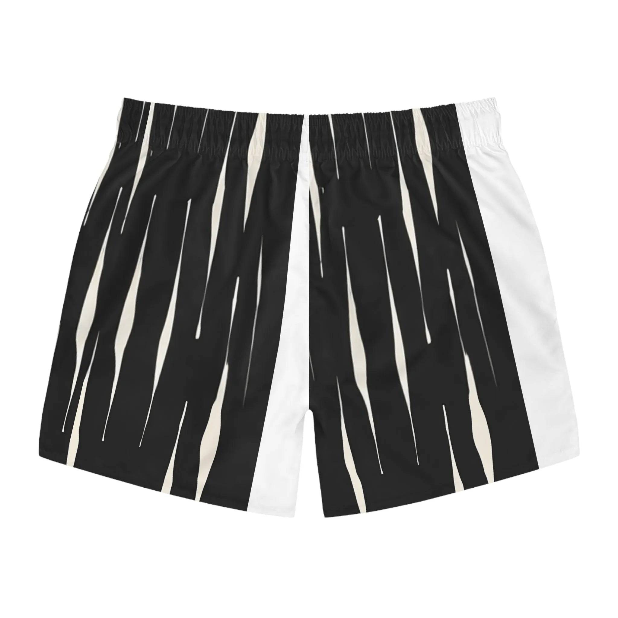 Model wearing Breakin' Atoms "Monochrome Strike Shorts," black and white split-panel shorts with vertical stripe detailing and signature branding — combining clean minimalism with sharp streetwear edge.