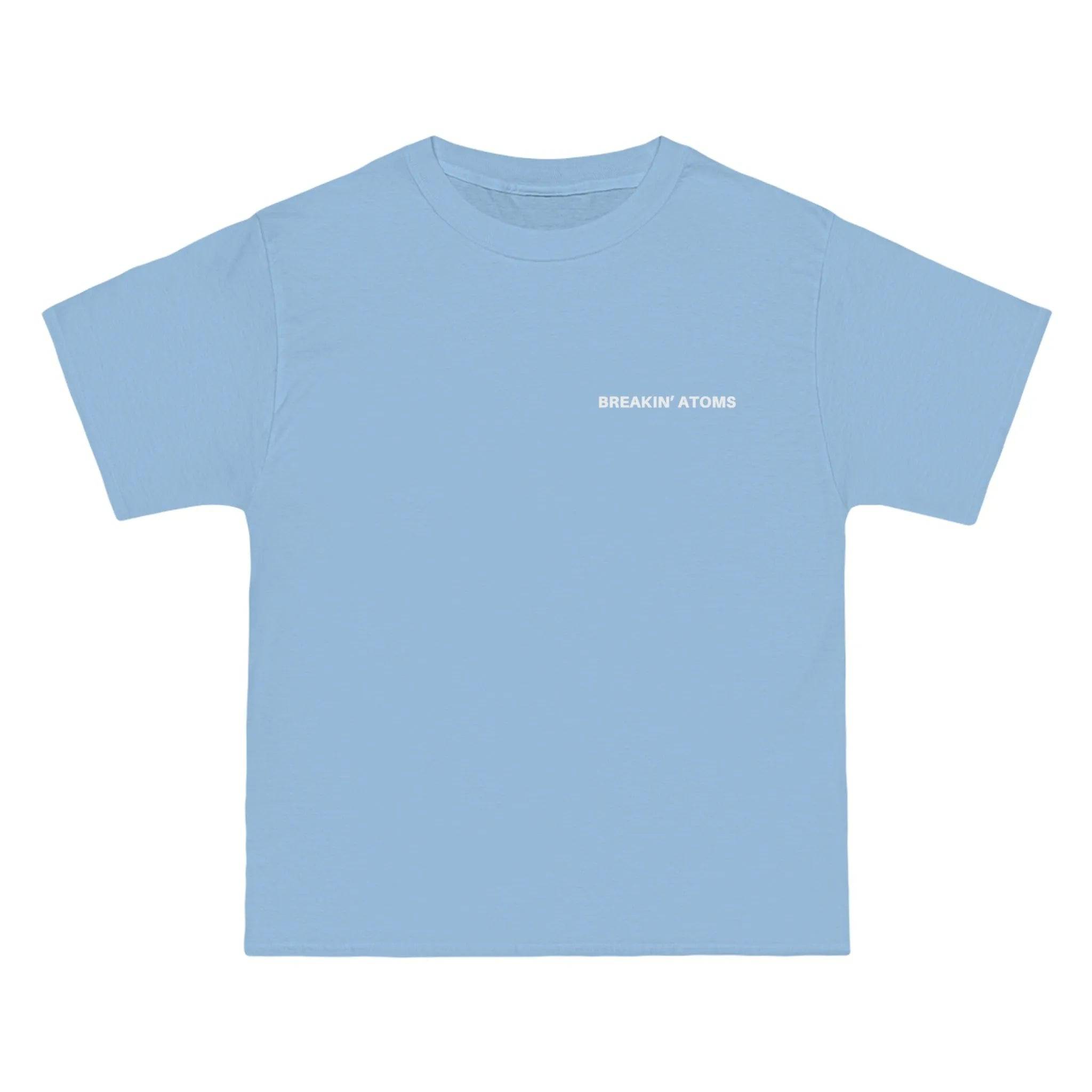 Model wearing Breakin' Atoms "Take Flight Shirt," a short sleeve button-up featuring a bold abstract design with avian-inspired graphics, ideal for expressive streetwear and modern creative wardrobes.