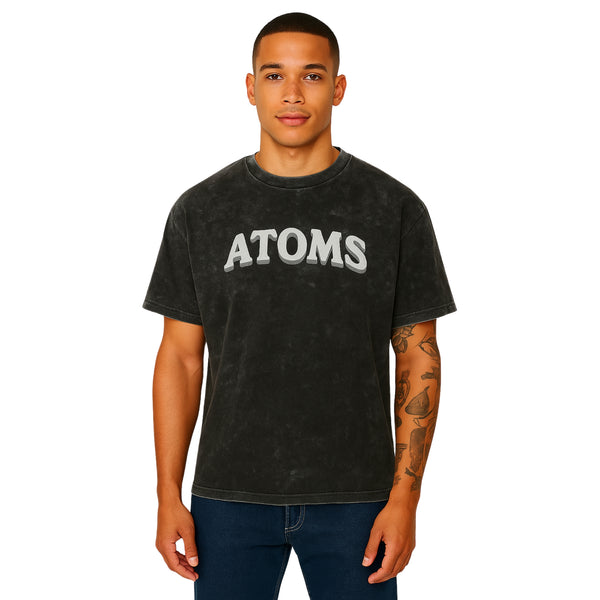 Model wearing Breakin' Atoms "Element Tee – Mineral Wash," a vintage-washed short sleeve t-shirt with a relaxed fit and minimalist front design — perfect for laid-back streetwear styling.