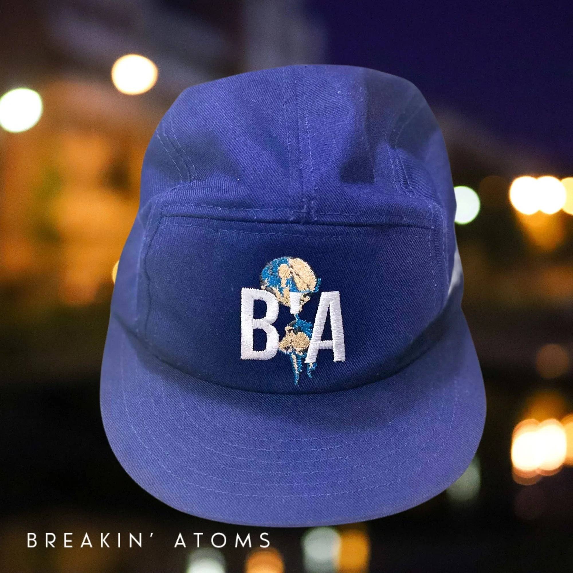 Front view of Breakin' Atoms 5-Panel “B'A” Hat in bold red, featuring structured fit and white embroidered “B’A” initials — a sleek, modern take on classic streetwear headwear.