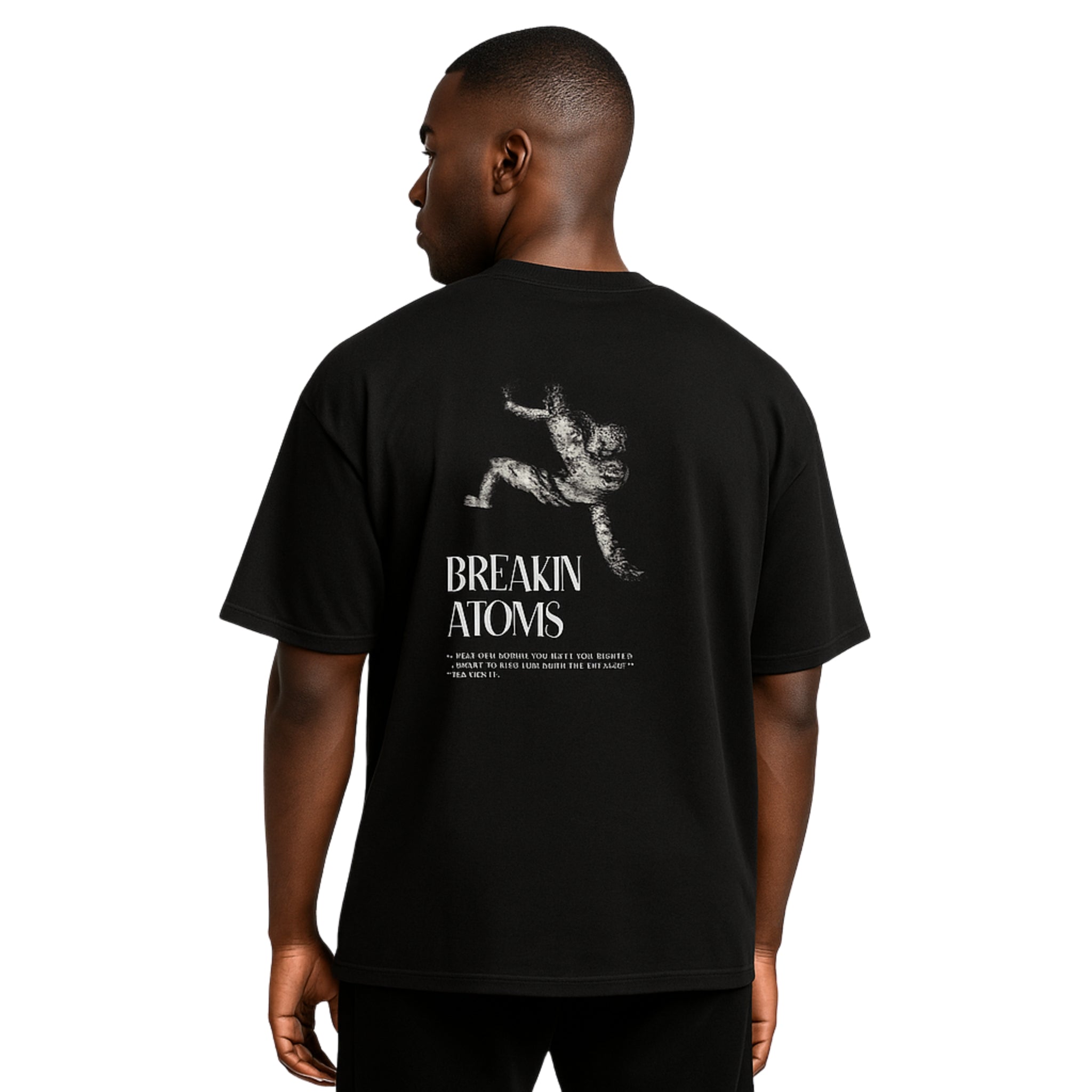 Model wearing Breakin' Atoms "Leap of Fate Shirt" — a conceptual graphic tee featuring surreal art that captures a bold jump into the unknown, symbolizing courage, transformation, and forward motion in streetwear form.