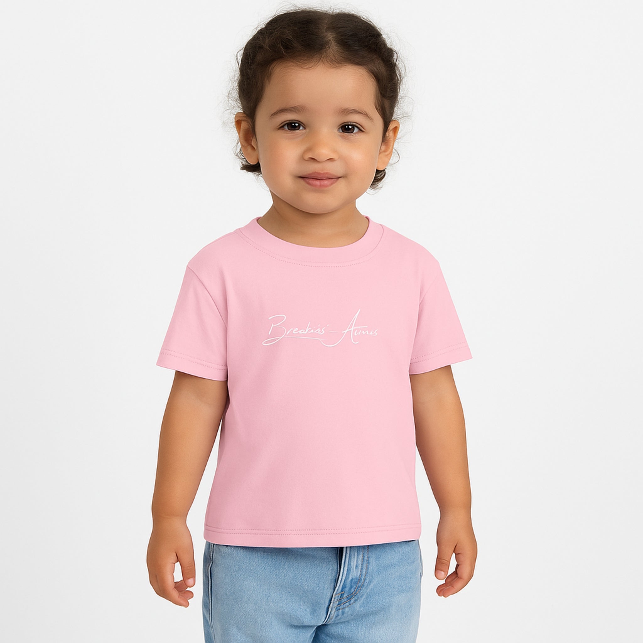 Child wearing Breakin' Atoms "The Little Voyager Tee," a kids’ graphic t-shirt featuring a whimsical space travel design that celebrates curiosity, creativity, and big dreams.