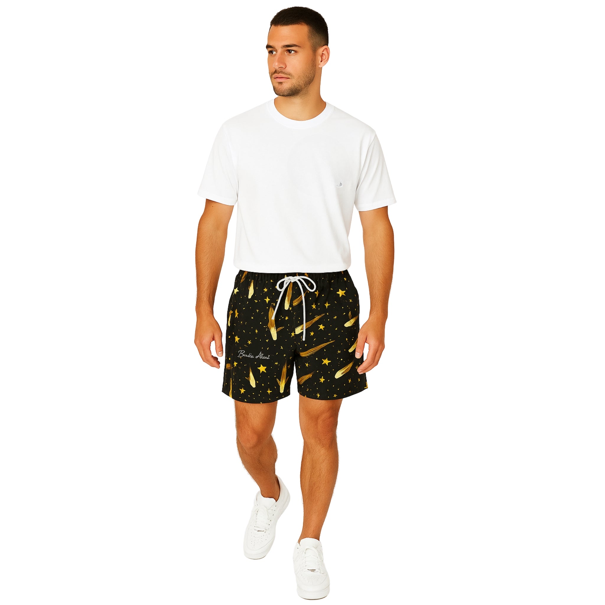 Model wearing Breakin' Atoms "Meteor Shower Shorts," featuring a dynamic all-over print inspired by cosmic meteor trails — a bold, space-themed statement piece designed for motion and impact.