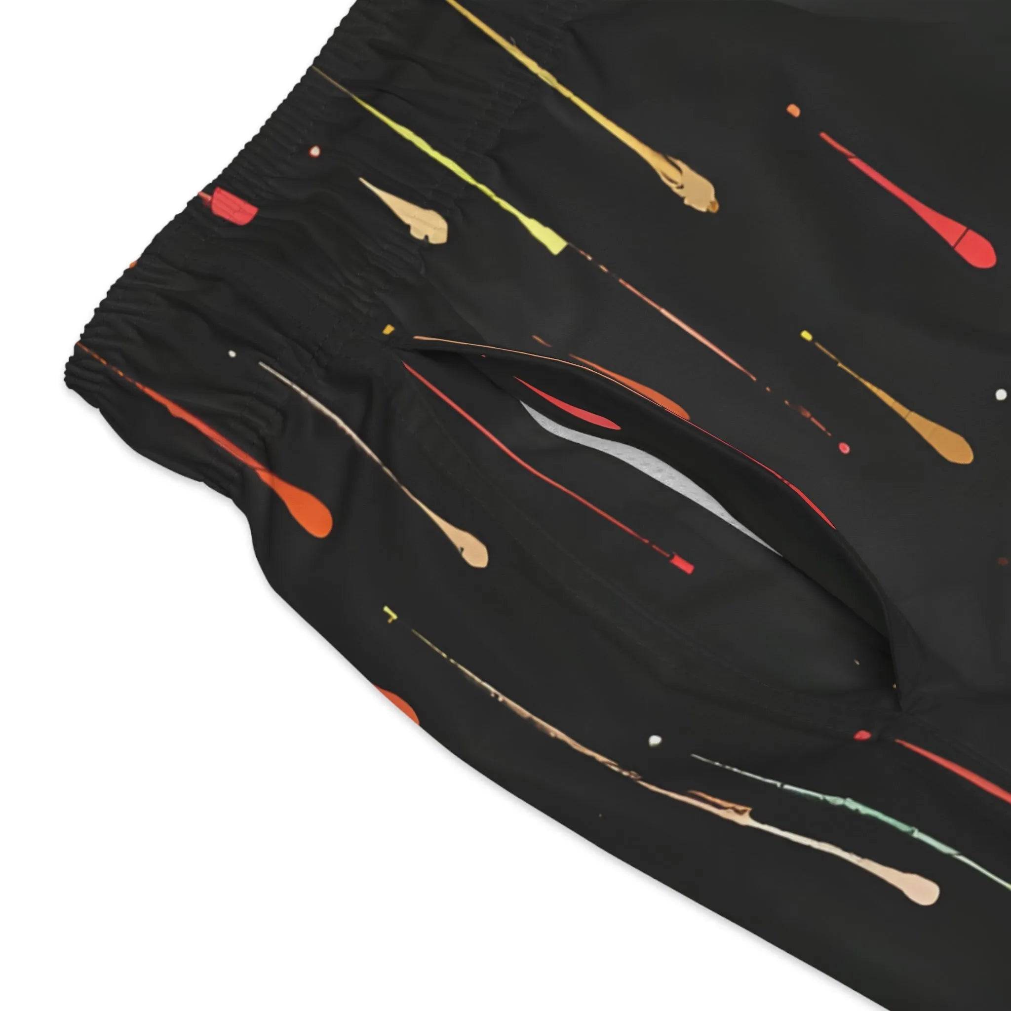 Model wearing Breakin' Atoms "Aurora Drops Shorts," featuring a vibrant, colorful drip-print inspired by the aurora borealis — a statement streetwear piece with cosmic energy and movement.