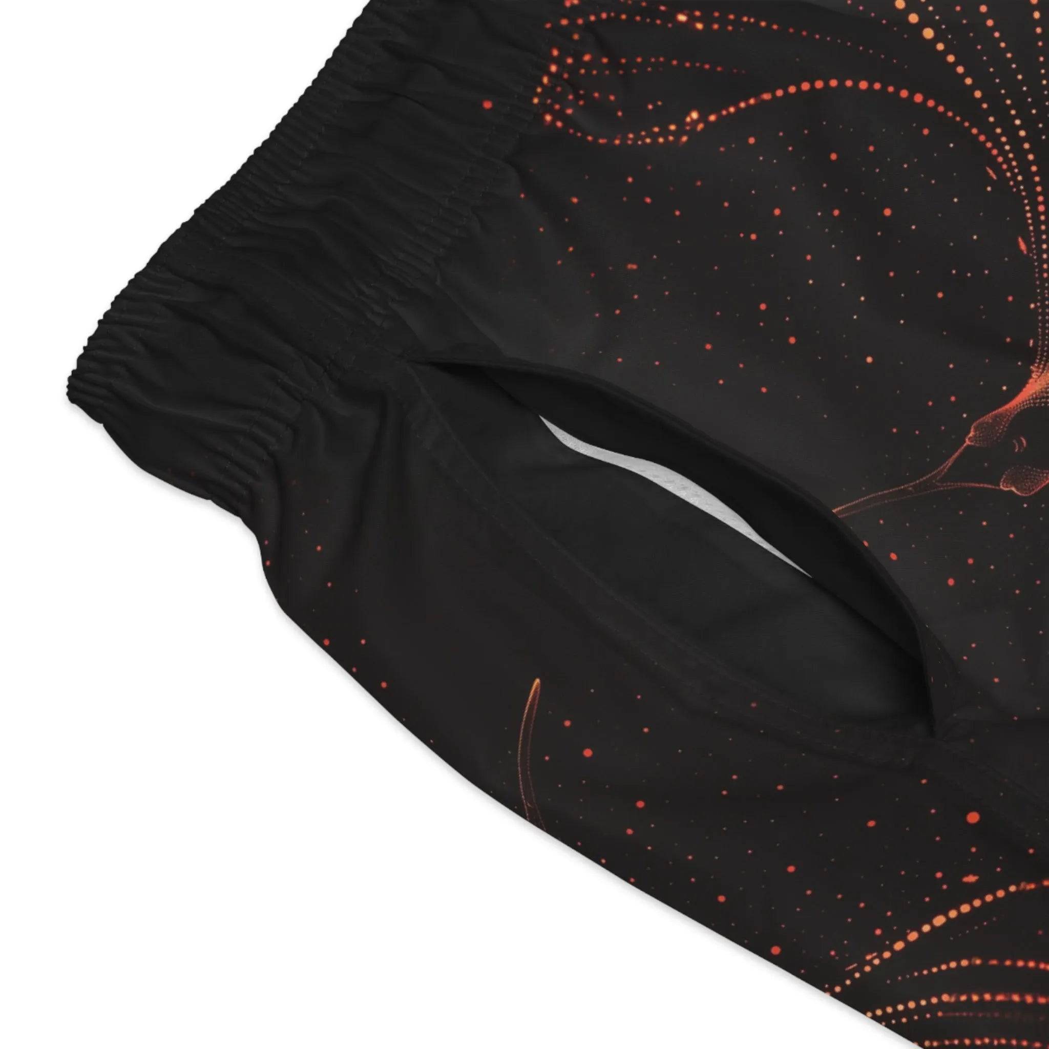 Model wearing Breakin' Atoms "Fiery Phoenix Shorts," black athletic-fit shorts featuring a vibrant rising phoenix graphic in red and orange — symbolizing power, rebirth, and unstoppable energy.