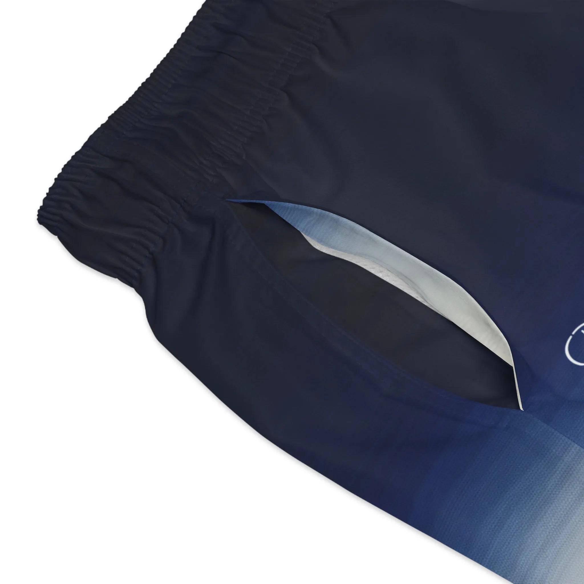 Model wearing Breakin' Atoms "Gradient Horizon Shorts," lightweight shorts with a sunset-inspired gradient colorway — perfect for summer streetwear and creative warm-weather outfits.