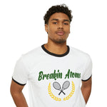 Breakin' Atoms Tennis Hills Ringed Tee - BREAKIN' ATOMSModel wearing Breakin' Atoms "Tennis Hills Ringed Tee," a vintage-style ringer t-shirt with contrast neckline and sleeve hems, featuring a scenic tennis hills graphic — blending sport heritage with casual lifestyle wear. thumbnail 1