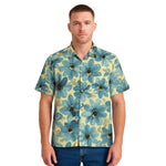 Model wearing Breakin' Atoms "Daisy Mosaic Vacation Button-Up," a lightweight short sleeve shirt with all-over abstract daisy floral print and relaxed fit — ideal for tropical getaways and summer street style. thumbnail 1