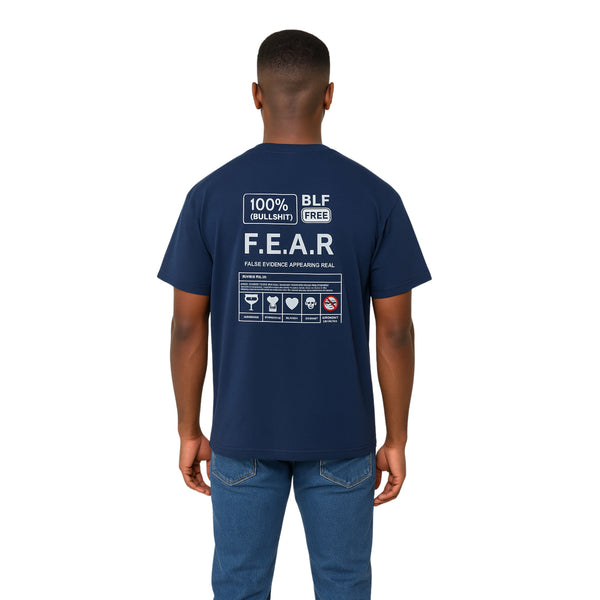 Breakin' Atoms "F.E.A.R." tee in sports dark navy with bold back graphic breaking down 'False Evidence Appearing Real' — complete with mock nutrition label and icons for overthinking, regret, and procrastination.