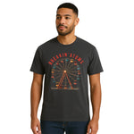 Model wearing Breakin’ Atoms "Ferris Wheel Tee" — a nostalgic graphic t-shirt featuring a stylized ferris wheel design, evoking amusement park vibes and a playful, retro aesthetic.
 thumbnail 1