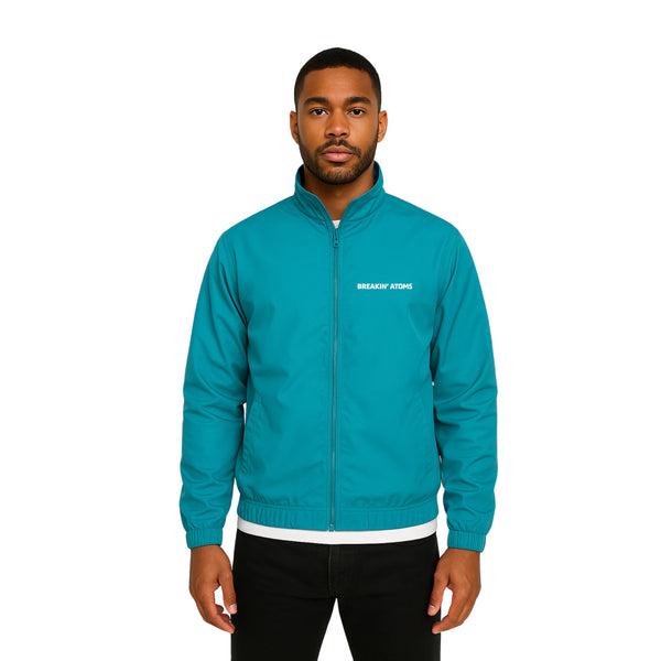Model wearing Breakin' Atoms "Flyest Windbreaker Jacket" featuring bold color-blocked panels, lightweight zip-up design, and a high-collar fit for retro-inspired streetwear style.