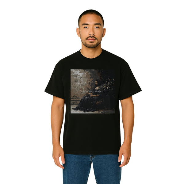Model wearing Breakin' Atoms "Pixelated Mona Tee," a modern short sleeve t-shirt featuring a pixelated twist on the Mona Lisa — blending classic art with digital-age streetwear flair.