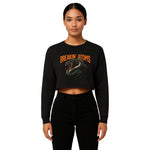 Model wearing Breakin’ Atoms "Serpent Strike Crop Top" — a bold, fitted cropped tee featuring a striking serpent graphic and clean typography, blending mystique, power, and sharp streetwear style. thumbnail 1