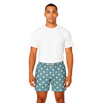 Model wearing Breakin' Atoms "Star-Spangled Shorts," featuring a bold navy blue and cream color block design with scattered star prints — a modern twist on patriotic fashion perfect for summer and festival wear. thumbnail 1