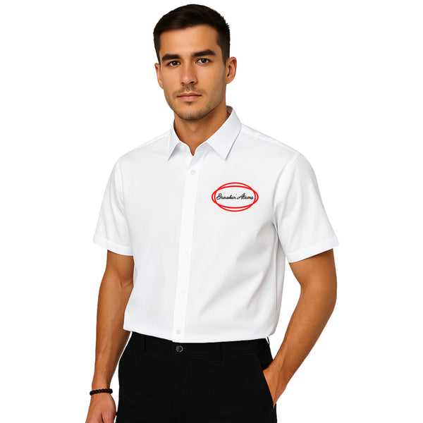 Model wearing Breakin' Atoms "Work Shirt," a structured short sleeve button-up inspired by classic utility and mechanic shirts, featuring durable fabric and embroidered logo details — built for function and streetwear form.